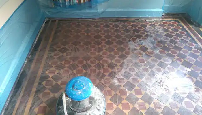 Historic Minton tile floor during controlled coating removal and residue extraction